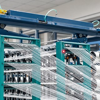 Warping creel at DFR, yarn ends drawn off the packages